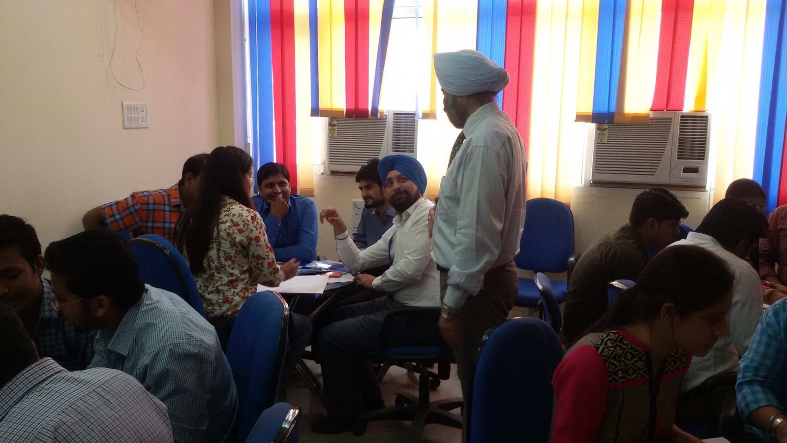 Corporate banking professionals engaged in lateral thinking exercise